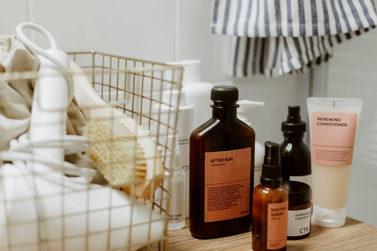 A collection of skincare products arranged stylishly in a bathroom setting for a relaxing vibe.